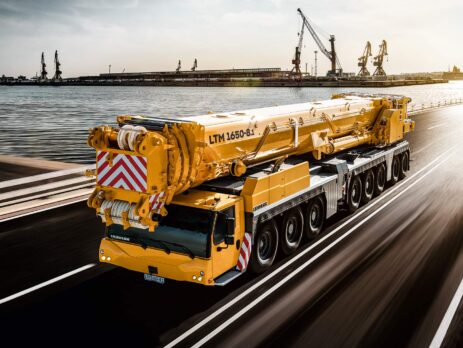 a large yellow truck on a road